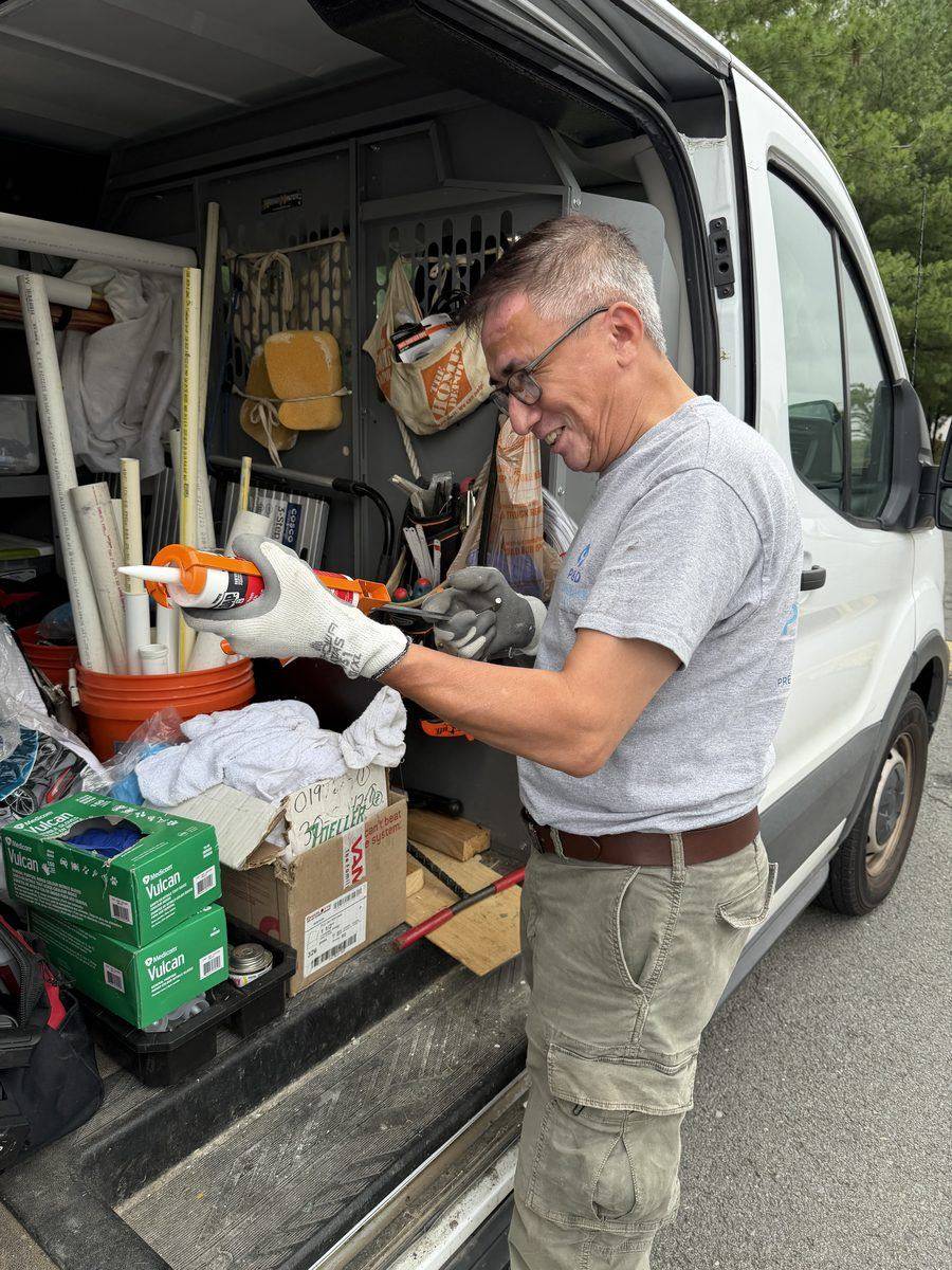 P & D Plumbing technician preparing sealant